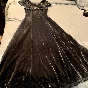 Beautiful Shiny Silver longdress with black background.Used Excellent condition